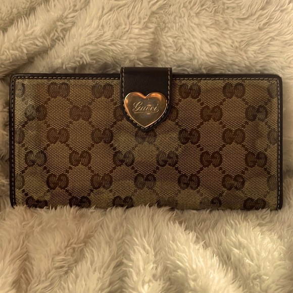 Gucci Handbags - Gucci brown and tan canvas and leathered trim long bifold wallet w GGgold heart